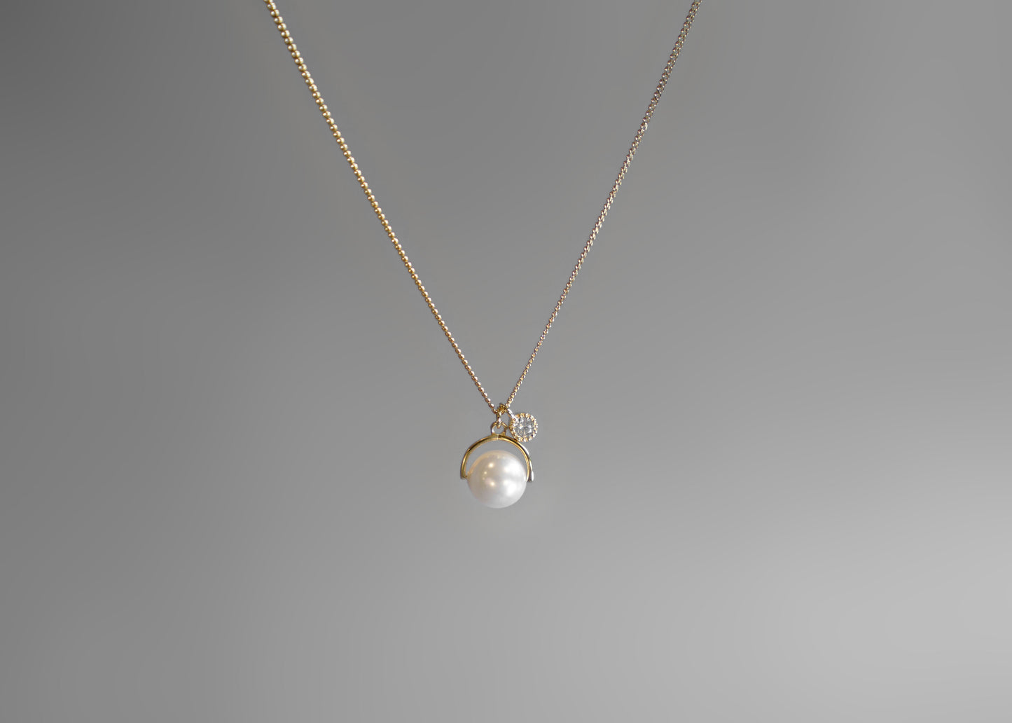 Sylvia Rotating Pearl & Twinkle Necklace